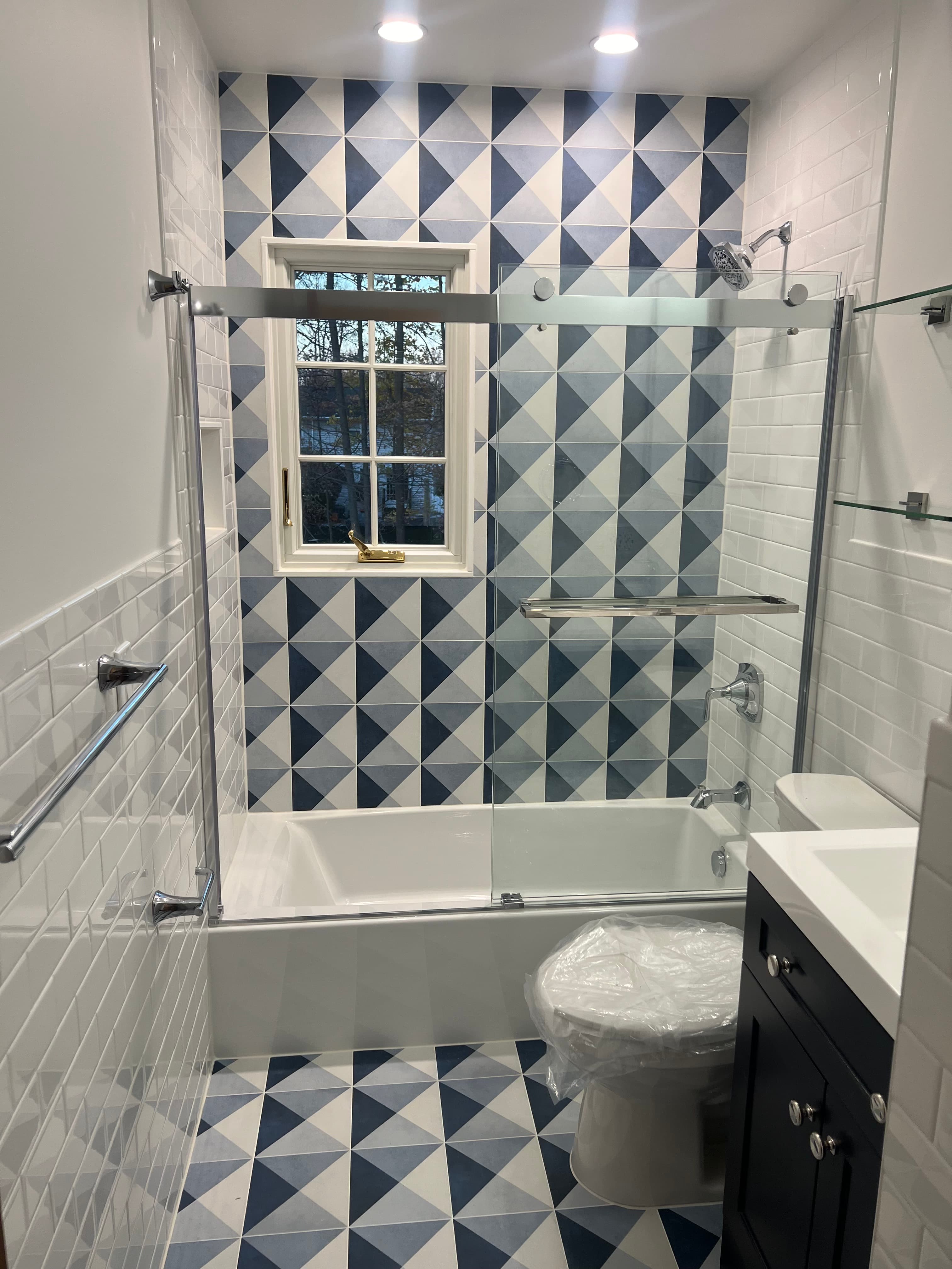 Modern bathroom with geometric tile patterns